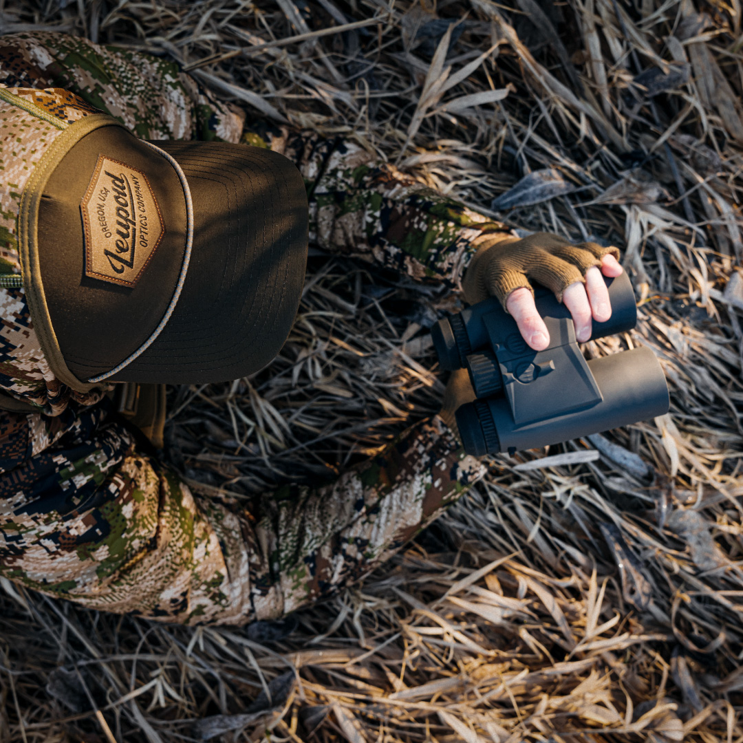man on hill looking through leupold sx-4 pro guide hd gen 2 spotting scope on tripod