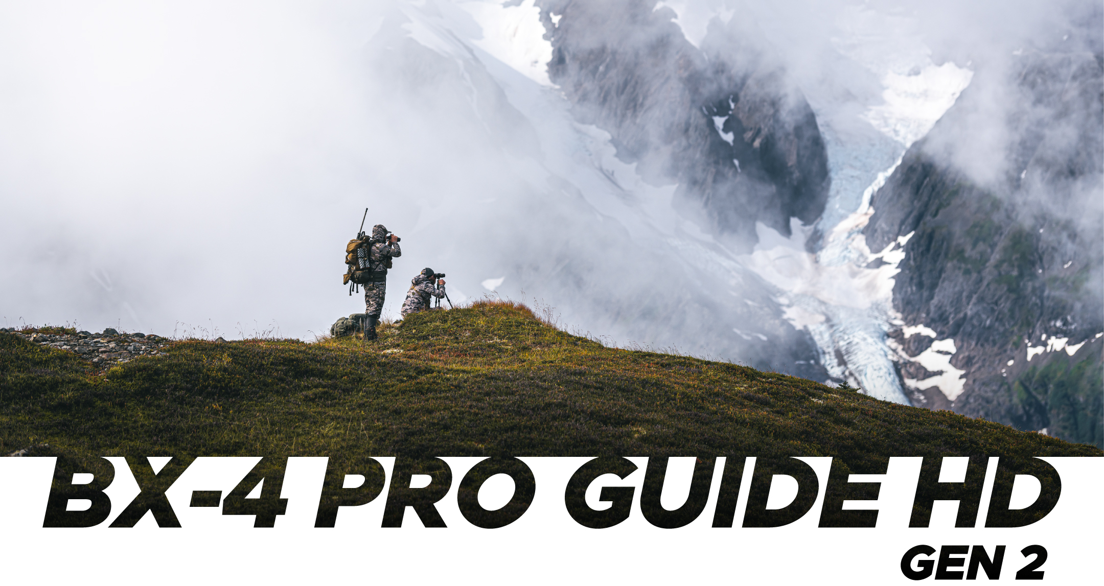 image of hunters on cliff edge looking at mountain landscape through leupold bx-4 pro guide hd gen 2 binoculars