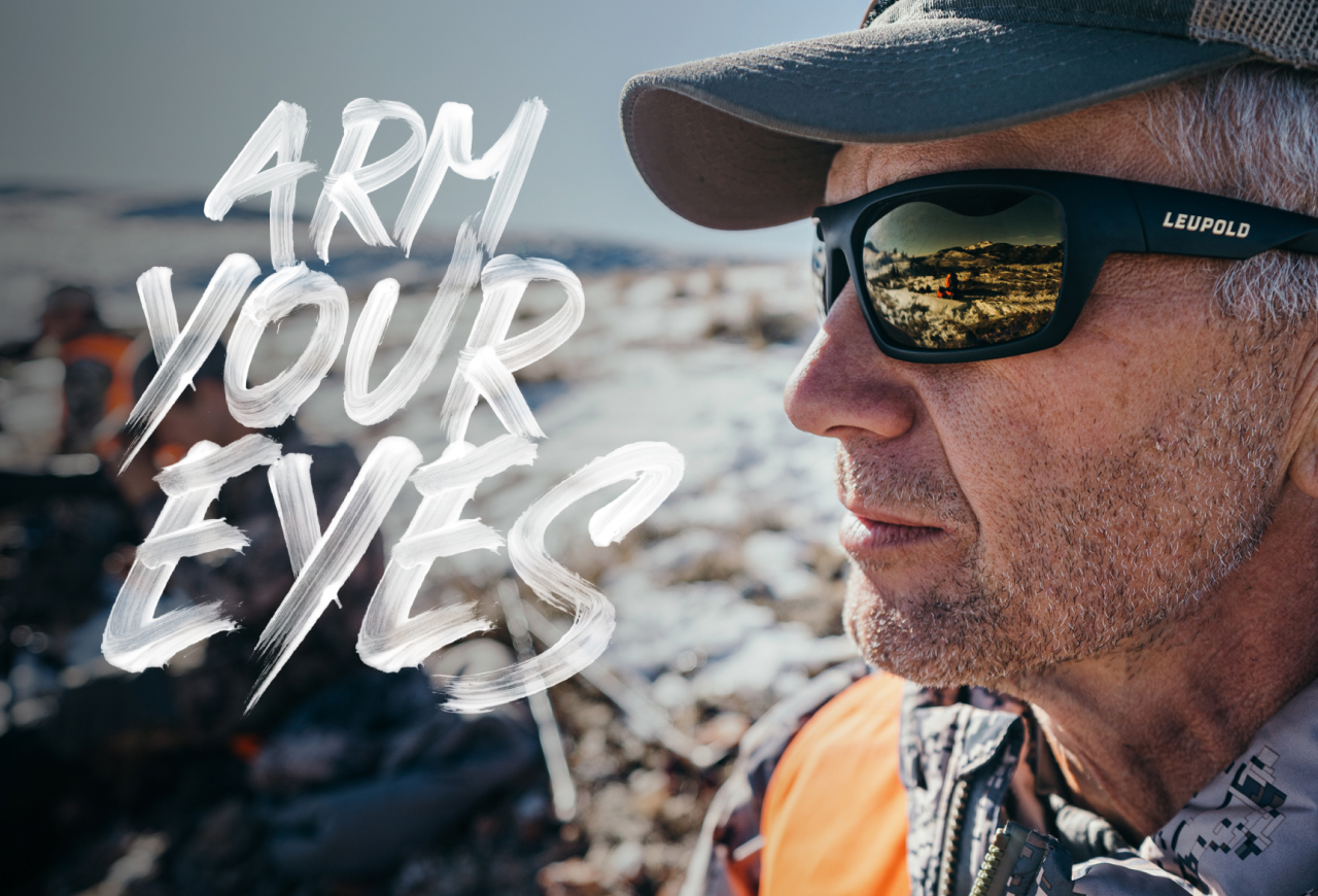 Upclose image of man standing outside in sunshine wearing Leupold performance eyewear sunglasses.