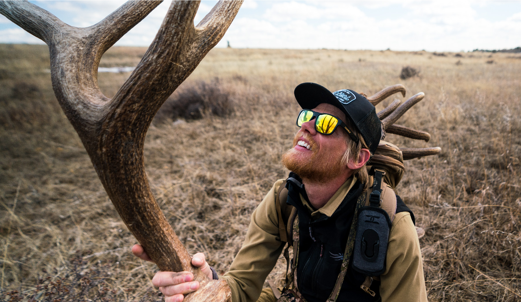 Hunter holds elk shed